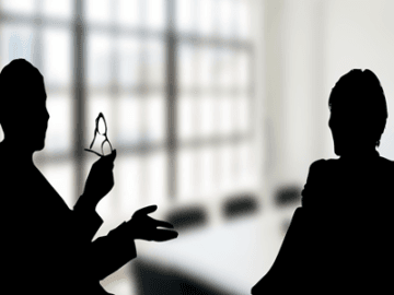 lexsense_sihlouette-man-and-woman-sitting-side-to-side